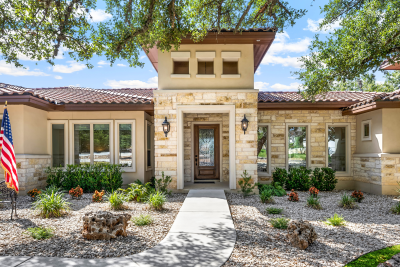 Luxury Texas home exterior representing a real estate transaction process